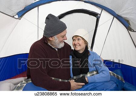 Senior couple embracing in a tent View Large Photo Image Stock Photography - Senior couple embracing in a tent. Fotosearch