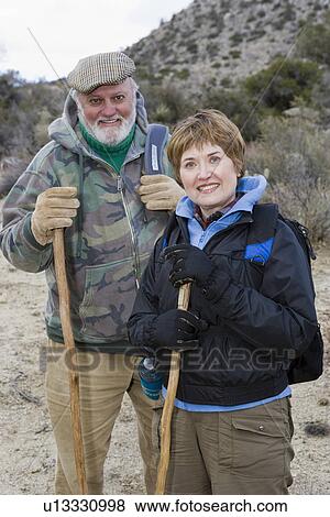 Stock Photo - Senior couple hiking, portrait. Fotosearch