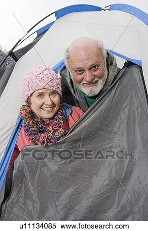 Senior couple in entrance to tent, portrait View Large Photo Image Stock Photography - Senior couple in entrance to tent, portrait. Fotosearch