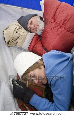 Senior couple sleeping in tent View Large Photo Image Stock Photo - Senior couple sleeping in tent. Fotosearch