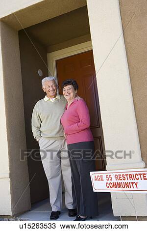Senior couple standing in doorway View Large Photo Image Stock Image - Senior couple standing in doorway. Fotosearch