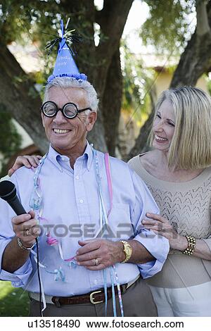Stock Image - Senior man celebrating birthday. Fotosearch