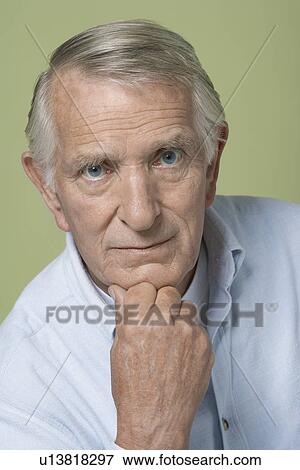 Senior Man, hand on chin, close-up View Large Photo Image Stock Photo - Senior Man, hand on chin, close-up. Fotosearch