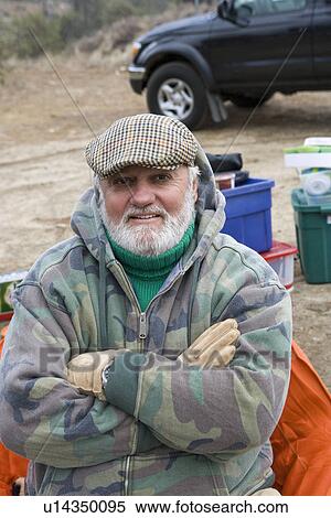 Senior man on camping trip, portrait View Large Photo Image Stock Photography - Senior man on camping trip, portrait. Fotosearch