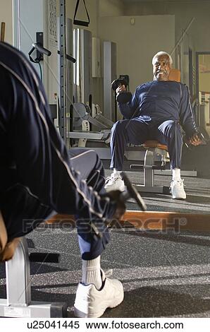 Stock Photography - Senior Man Weightlifting. Fotosearch