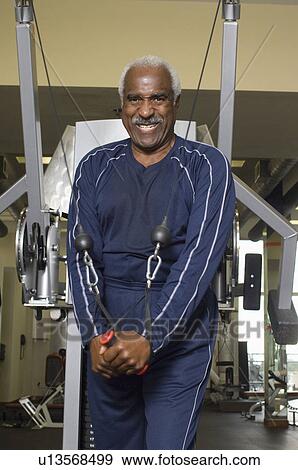 Senior Man Working Out on Weightlifting Machine View Large Photo Image Stock Photo - Senior Man Working Out on Weightlifting Machine. Fotosearch