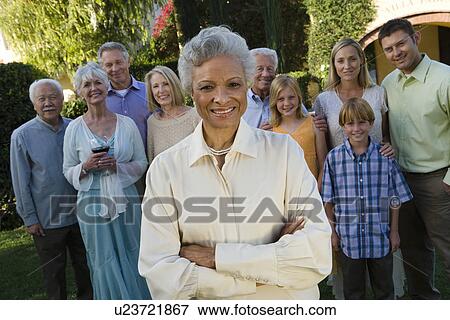 Senior woman celebrating with friends in garden View Large Photo Image Stock Photo - Senior woman celebrating with friends in garden. Fotosearch