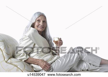 Senior Woman Having Glass of Champagne View Large Photo Image Stock Photo - Senior Woman Having Glass of Champagne. Fotosearch