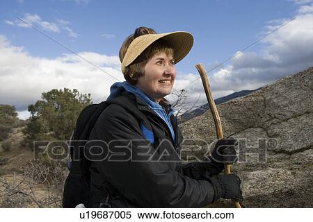 Senior woman hiking in mountains View Large Photo Image Stock Photography - Senior woman hiking in mountains. Fotosearch