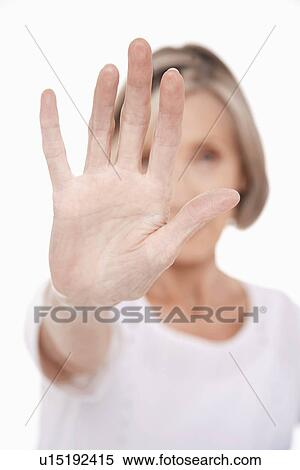 Senior woman holding up palm of hand, studio shot View Large Photo Image Stock Photography - Senior woman holding up palm of hand, studio shot. Fotosearch