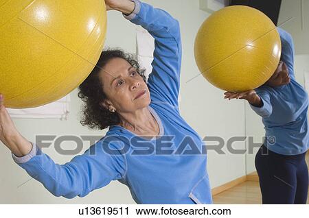 Senior Woman Using Exercise Ball in Fitness Class View Large Photo Image Stock Image - Senior Woman Using Exercise Ball in Fitness Class. Fotosearch