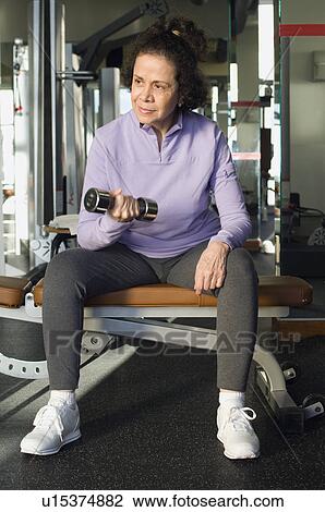 Stock Image - Senior Woman Weightlifting With Dumbbell. Fotosearch