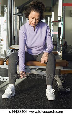 Stock Photograph - Senior Woman Weightlifting With Dumbbell. Fotosearch