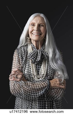 Senior Woman with Arms Folded, smiling View Large Photo Image Stock Photograph - Senior Woman with Arms Folded, smiling. Fotosearch
