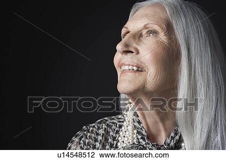 Senior Woman with Long Hair, looking up View Large Photo Image Stock Image - Senior Woman with Long Hair, looking up. Fotosearch