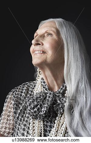 Senior Woman with Long Hair, looking up View Large Photo Image Stock Photo - Senior Woman with Long Hair, looking up. Fotosearch