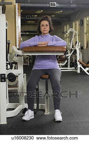 Senior Woman Working Out in Gym View Large Photo Image Stock Image - Senior Woman Working Out in Gym. Fotosearch