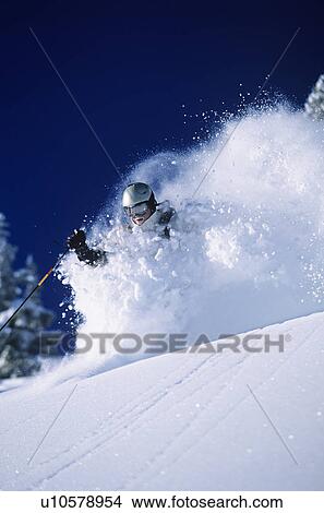 Skier in deep powder snow View Large Photo Image Picture - Skier in deep powder snow. Fotosearch