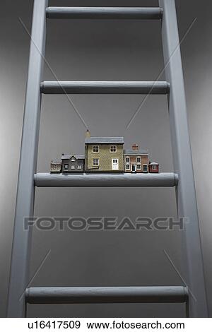 Small model houses on ladder View Large Photo Image Stock Photo - Small model houses on ladder. Fotosearch
