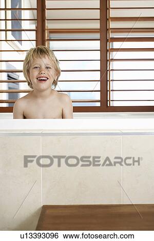 Smiling Boy sitting in Bathtub View Large Photo Image Stock Photograph - Smiling Boy sitting in Bathtub. Fotosearch