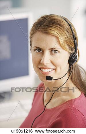 Stock Photograph - Smiling Customer Service Representative. Fotosearch