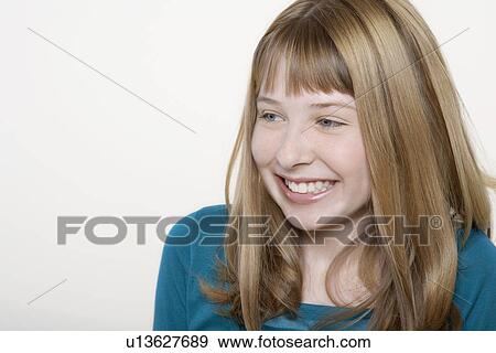 Stock Photo - Smiling teenage girl, close-up. Fotosearch
