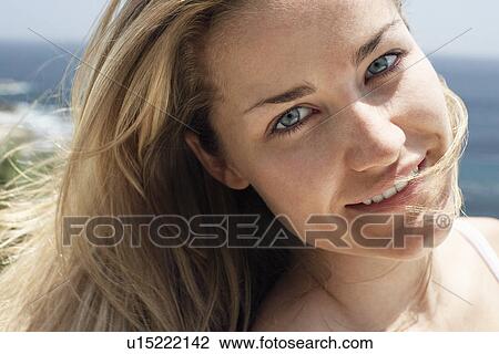 Smiling woman on beach, close-up, portrait View Large Photo Image Stock Image - Smiling woman on beach, close-up, portrait. Fotosearch