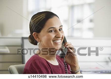 Stock Photo - Smiling Woman on the Phone. Fotosearch