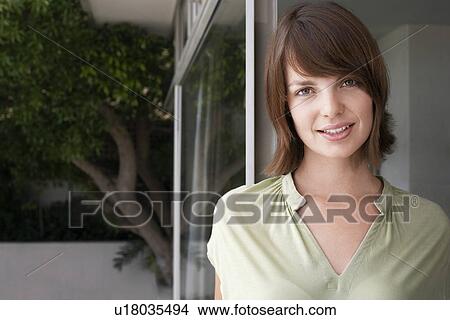 Picture - Smiling woman outdoors, portrait. Fotosearch
