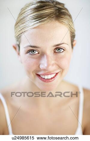 Stock Photography - Smiling Young Woman, portrait, close up. Fotosearch