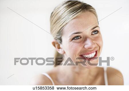 Stock Photo - Smiling Young Woman. Fotosearch