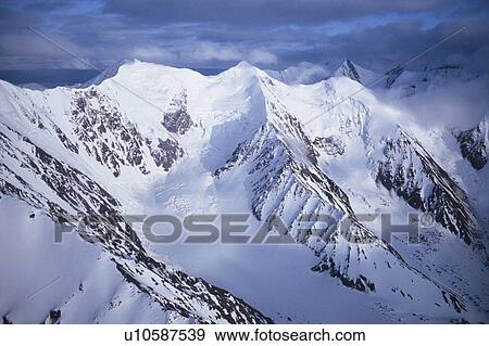 Snow-covered Mountains View Large Photo Image Stock Photo - Snow-covered Mountains. Fotosearch