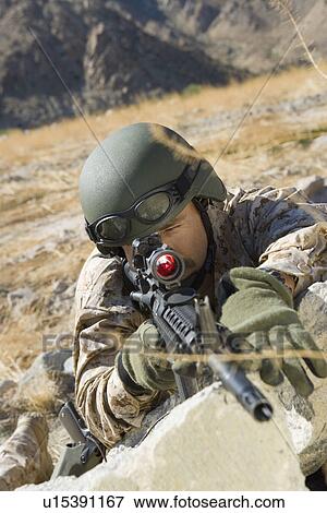Soldier aiming rifle, outdoors View Large Photo Image Stock Photo - Soldier aiming rifle, outdoors. Fotosearch