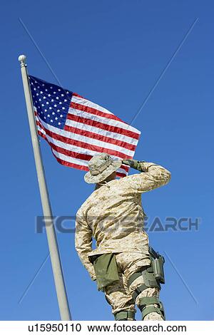 Soldier saluting United States flag, outdoors, (low angle view) View Large Photo Image Stock Image - Soldier saluting United States flag, outdoors, (low angle view). Fotosearch