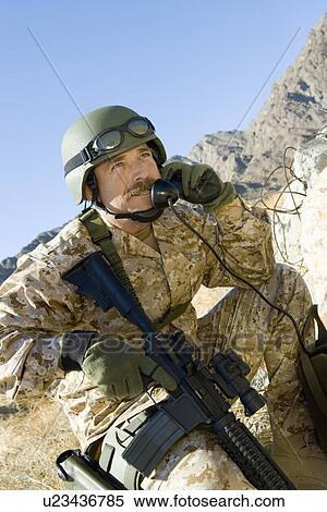 Soldier using field phone in mountains View Large Photo Image Stock Photography - Soldier using field phone in mountains. Fotosearch