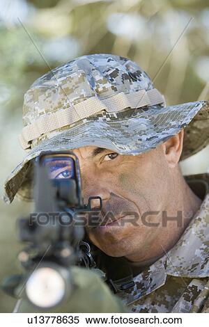 Soldier using rifle, outdoors, (close-up) View Large Photo Image Stock Photography - Soldier using rifle, outdoors, (close-up). Fotosearch