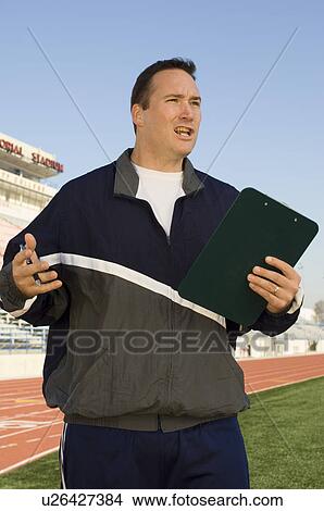 Sports coach giving instructions View Large Photo Image Picture - Sports coach giving instructions. Fotosearch