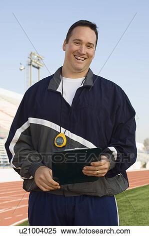 Sports coach on stadium View Large Photo Image Stock Photography - Sports coach on stadium. Fotosearch