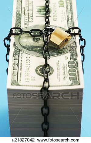 Stack of Dollars secured by padlock and chain View Large Photo Image Stock Image - Stack of Dollars secured by padlock and chain. Fotosearch