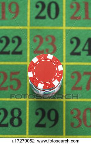 Stack of gambling chips on roulette table, view from above View Large Photo Image Stock Image - Stack of gambling chips on roulette table, view from above. Fotosearch