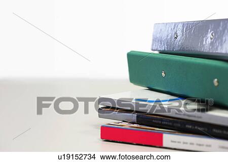 Stack of Magazines and Binders, close up View Large Photo Image Picture - Stack of Magazines and Binders, close up. Fotosearch