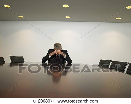 Stressed businessman in conference room View Large Photo Image Stock Image - Stressed businessman in conference room. Fotosearch