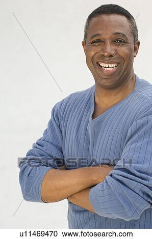 Studio portrait of man smiling View Large Photo Image Stock Image - Studio portrait of man smiling. Fotosearch