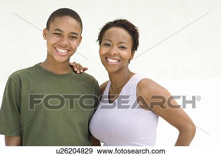 Studio portrait of mother and son smiling View Large Photo Image Stock Photo - Studio portrait of mother and son smiling. Fotosearch