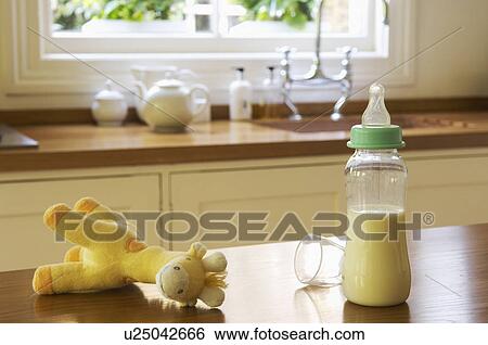 Stuffed animal and baby bottle on Kitchen Counter View Large Photo Image Stock Photograph - Stuffed animal and baby bottle on Kitchen Counter. Fotosearch