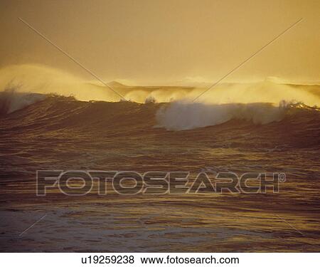 Stock Photo - Surf at twilight. Fotosearch