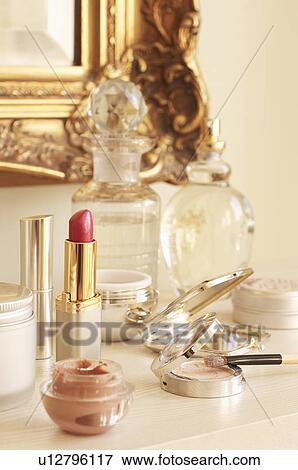 Table With lipstick and other Cosmetics and Wall Mirror View Large Photo Image Stock Photo - Table With lipstick and other Cosmetics and Wall Mirror. Fotosearch