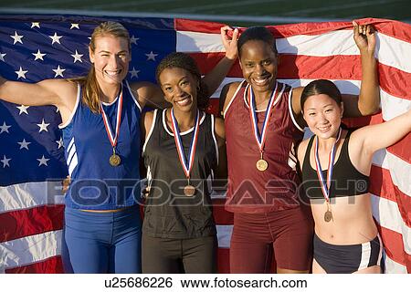 Team of American female athletes celebrating victory View Large Photo Image Stock Photograph - Team of American female athletes celebrating victory. Fotosearch