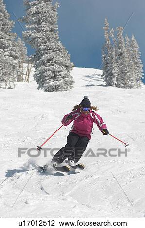 Teenage Girl (16-17) skiing down slope, front view. View Large Photo Image Stock Image - Teenage Girl (16-17) skiing down slope, front view.. Fotosearch