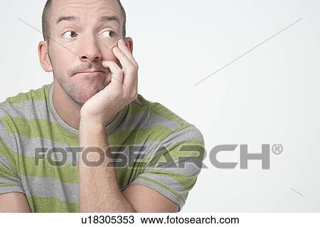 Thinking man with Head in Hands, looking to side, close-up View Large Photo Image Stock Image - Thinking man with Head in Hands, looking to side, close-up. Fotosearch